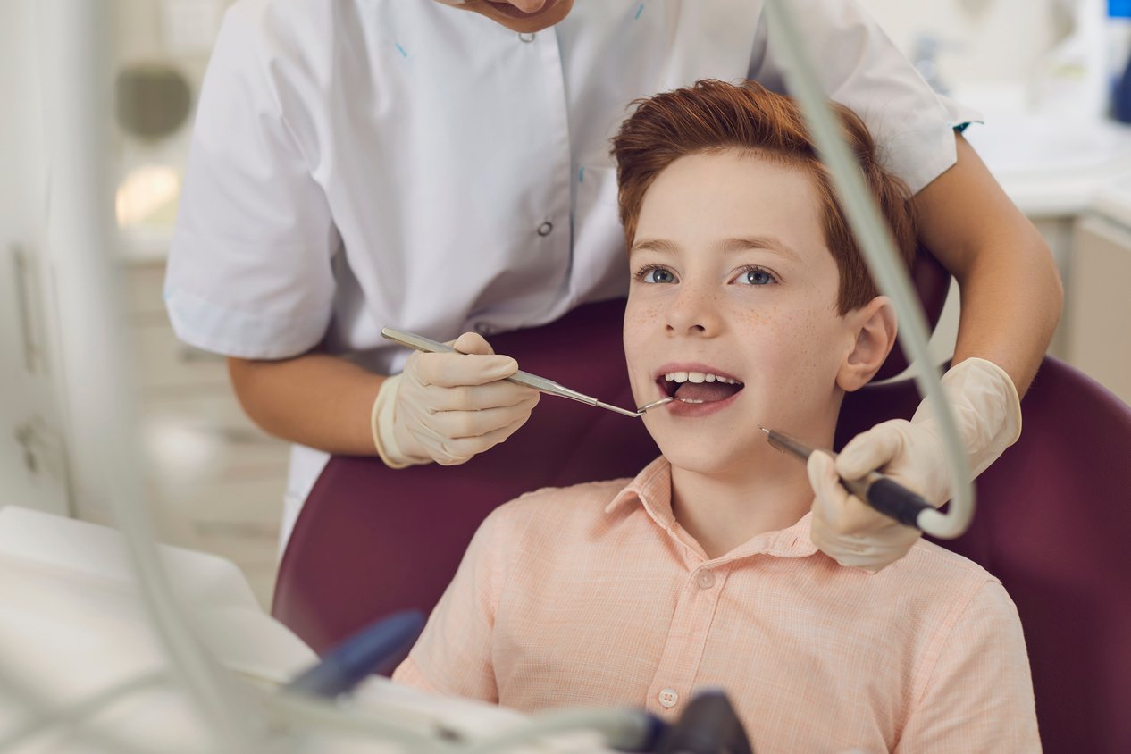 Child Boy Check-up in Dentist Office. Healthy Teeth and Smile. Children's Doctor Orthodontist.